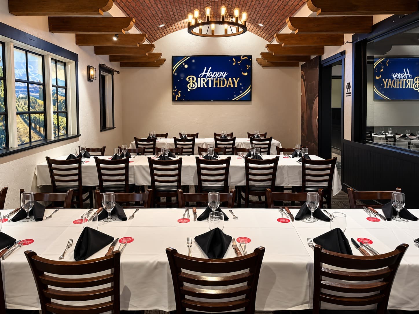 The Wine Room set for a birthday party under its vaulted brick ceiling